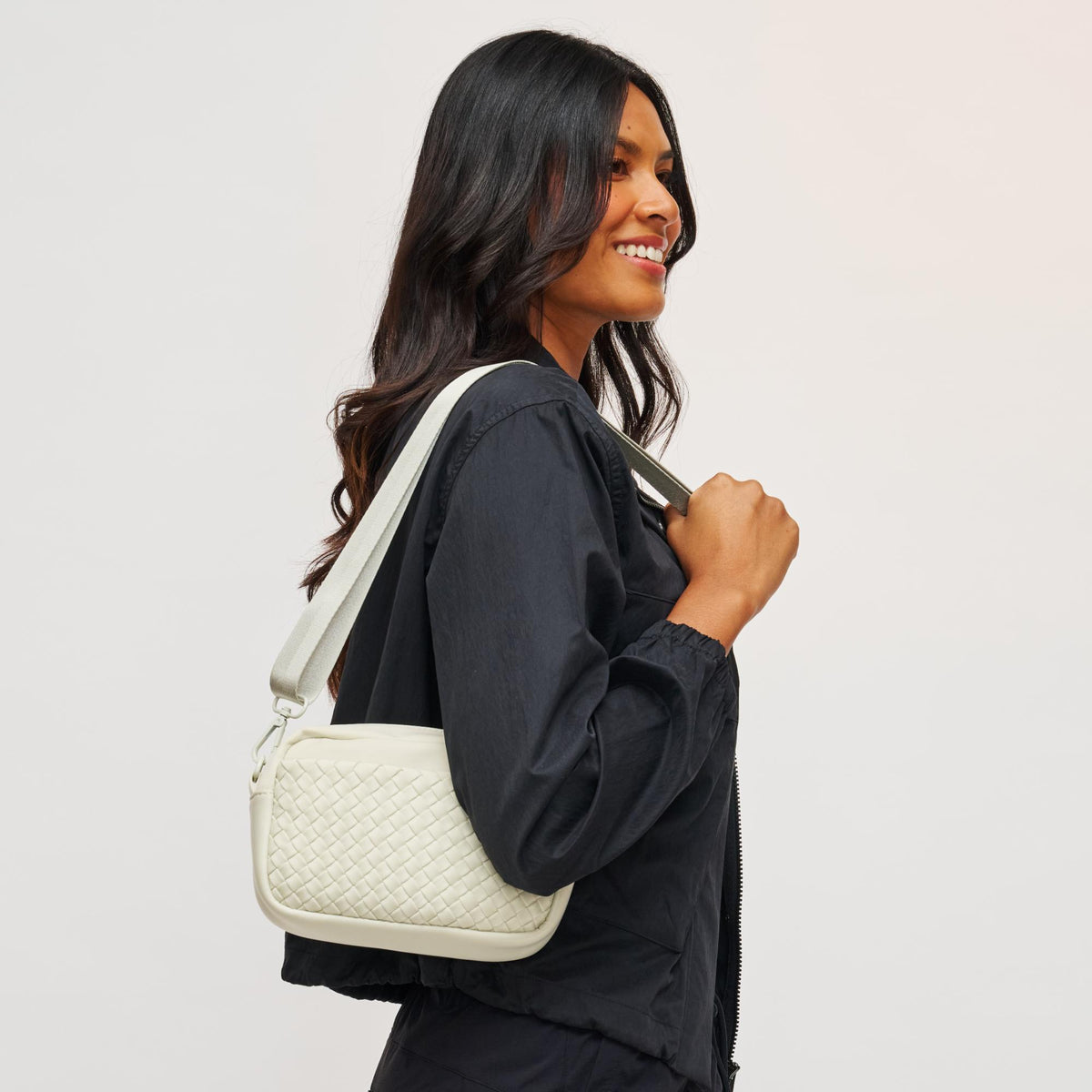 Woman wearing Bone Sol and Selene Inspiration - Woven Neoprene Crossbody 841764109215 View 2 | Bone