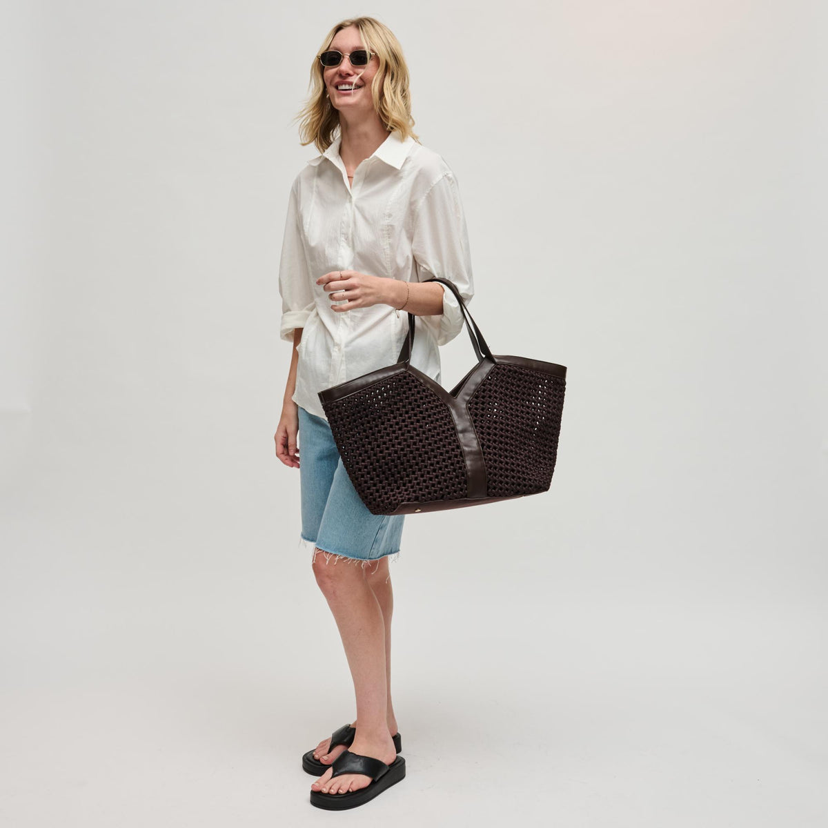 Woman wearing Chocolate Sol and Selene Calypso Tote 841764112918 View 4 | Chocolate