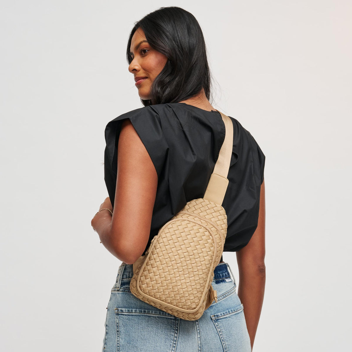 Woman wearing Nude Sol and Selene Beyond The Horizon - Woven Neoprene Sling Backpack 841764108041 View 1 | Nude
