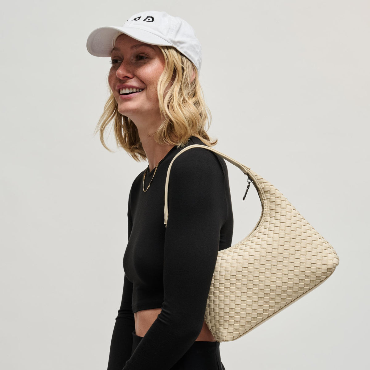 Woman wearing Cream Sol and Selene Harmonia - Woven Neoprene Shoulder Bag 841764112543 View 3 | Cream