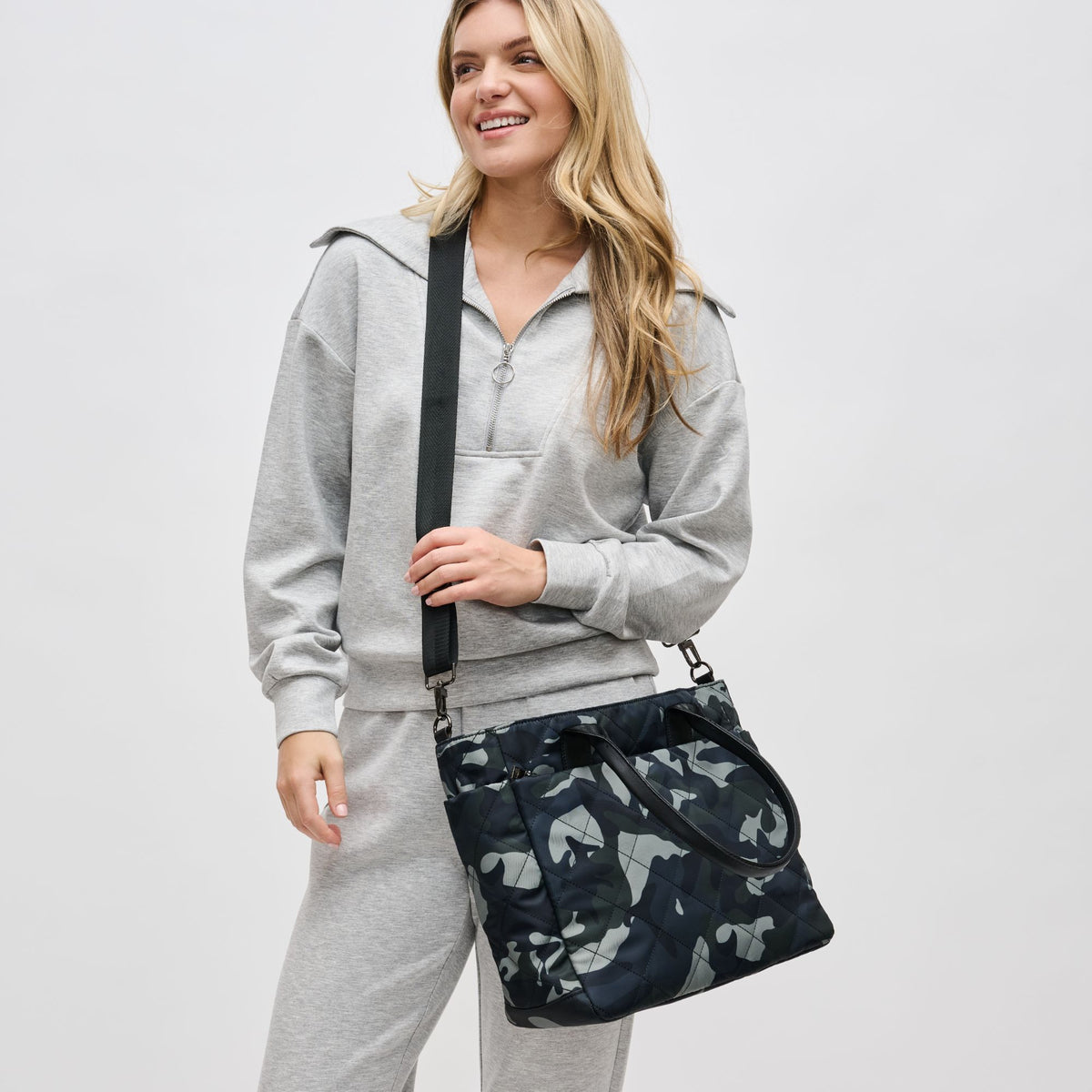 Woman wearing Green Camo Sol and Selene Motivator East West Tote 841764105712 View 3 | Green Camo