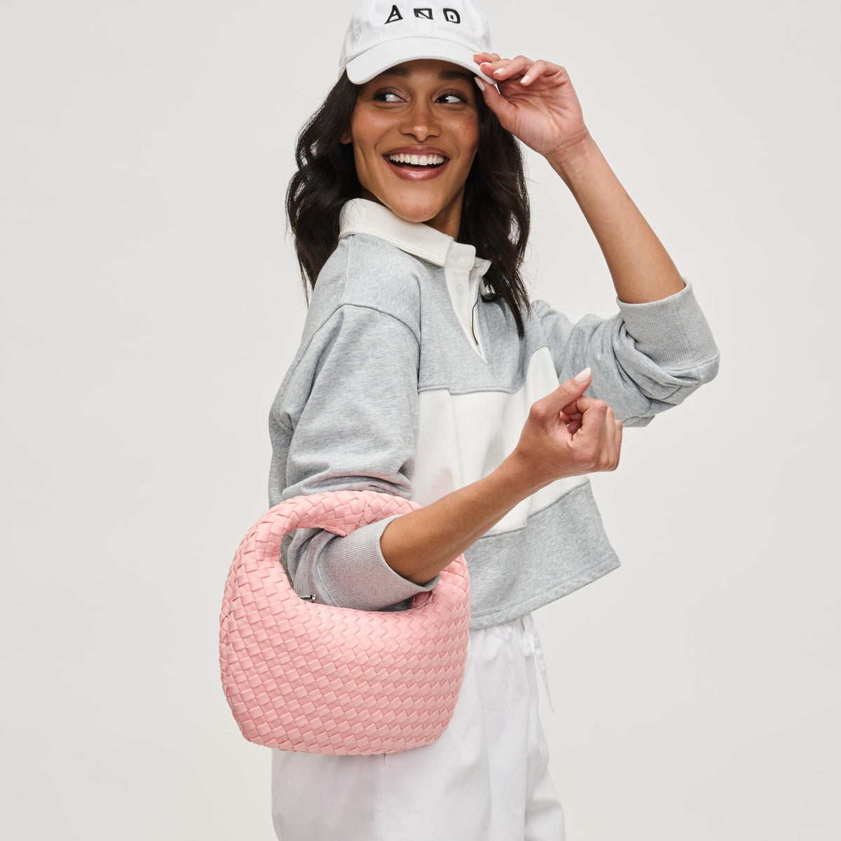 Woman wearing Blush Sol and Selene Dare to Dream - Small Woven Neoprene Clutch 841764111492 View 2 | Blush