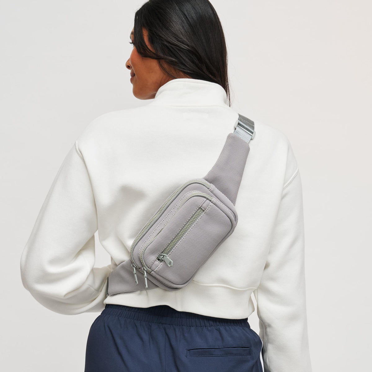 Woman wearing Grey Sol and Selene Hip Hugger - Neoprene Mesh Belt Bag 841764109871 View 2 | Grey