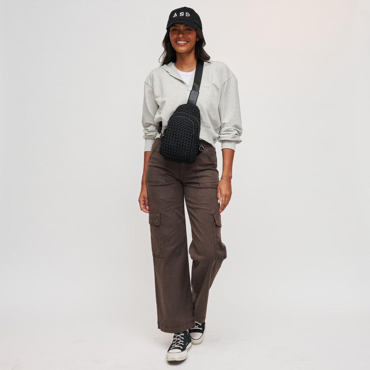 Woman wearing Black Sol and Selene Beyond The Horizon - Woven Neoprene Sling Backpack 841764108034 View 3 | Black