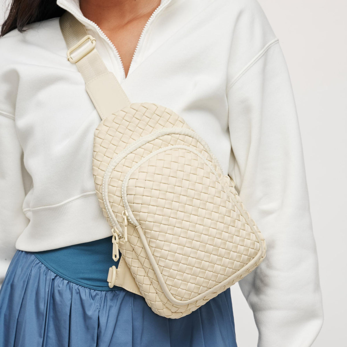 Woman wearing Cream Sol and Selene Beyond The Horizon - Woven Neoprene Sling Backpack 841764109277 View 1 | Cream
