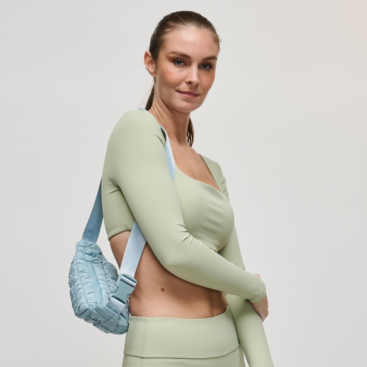 Woman wearing Sky Blue Sol and Selene Resurgence Belt Bag 841764109659 View 4 | Sky Blue