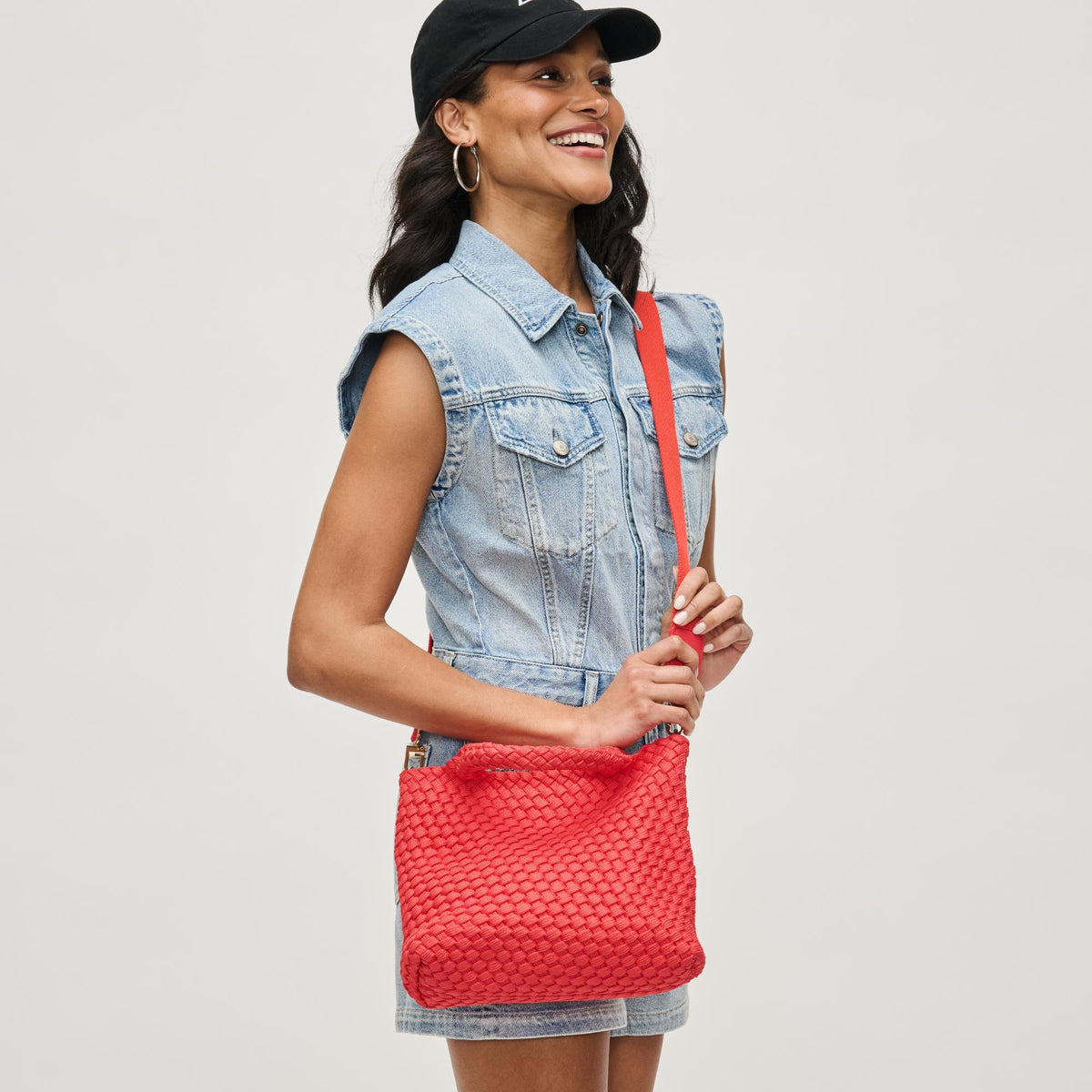 Woman wearing Coral Sol and Selene Sky's The Limit - Small Laced Up Eco-Edition Crossbody 841764111713 View 3 | Coral