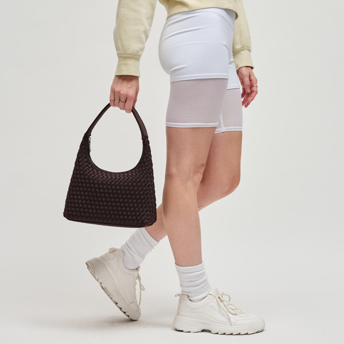 Woman wearing Chocolate Sol and Selene Harmonia - Woven Neoprene Shoulder Bag 841764112536 View 3 | Chocolate