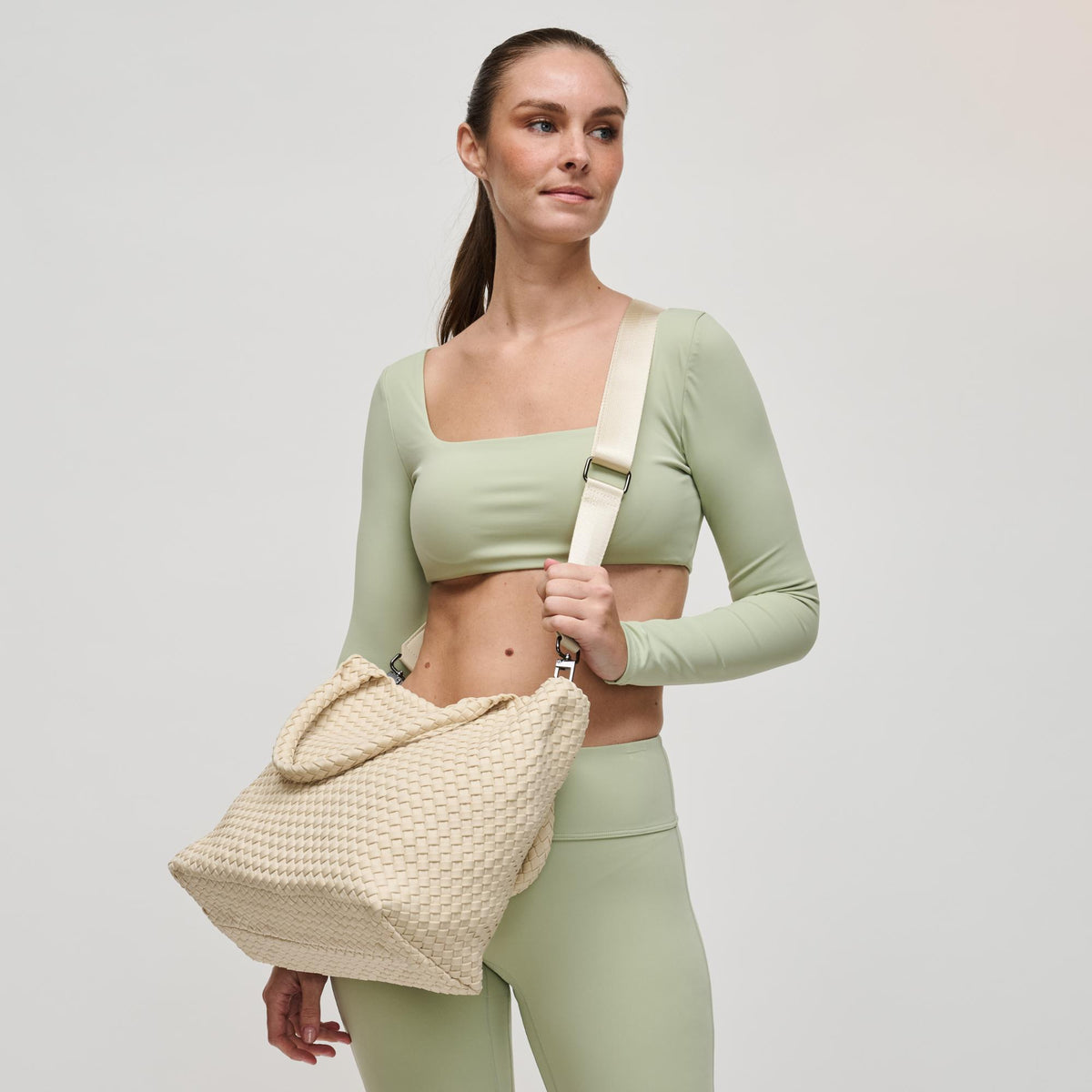 Woman wearing Cream Sol and Selene Sky's The Limit - Medium Tote 841764109246 View 2 | Cream