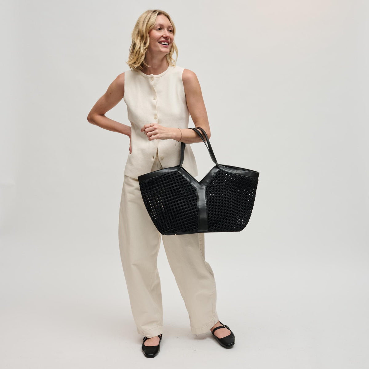 Woman wearing Black Sol and Selene Calypso Tote 841764112901 View 3 | Black