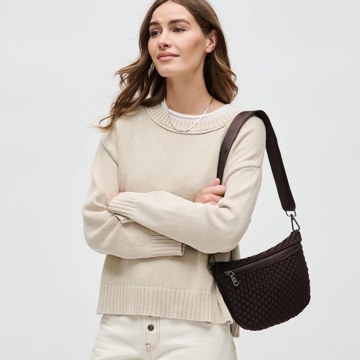 Woman wearing Chocolate Sol and Selene Ethereal - Woven Neoprene Crossbody 841764110853 View 2 | Chocolate