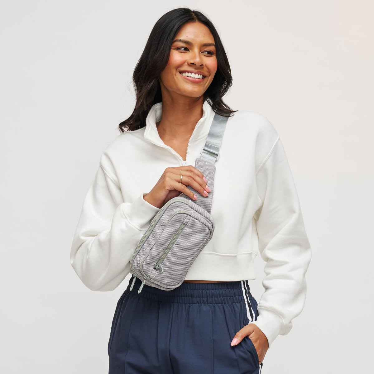Woman wearing Grey Sol and Selene Hip Hugger - Neoprene Mesh Belt Bag 841764109871 View 1 | Grey