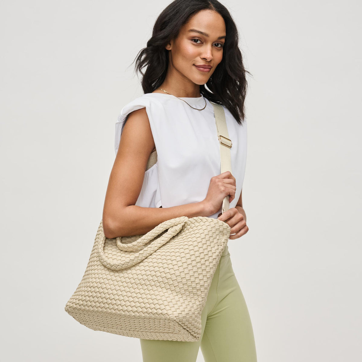 Woman wearing Beige Sol and Selene Sky's The Limit - Medium Laced Up Eco-Edition Tote 841764111584 View 3 | Beige