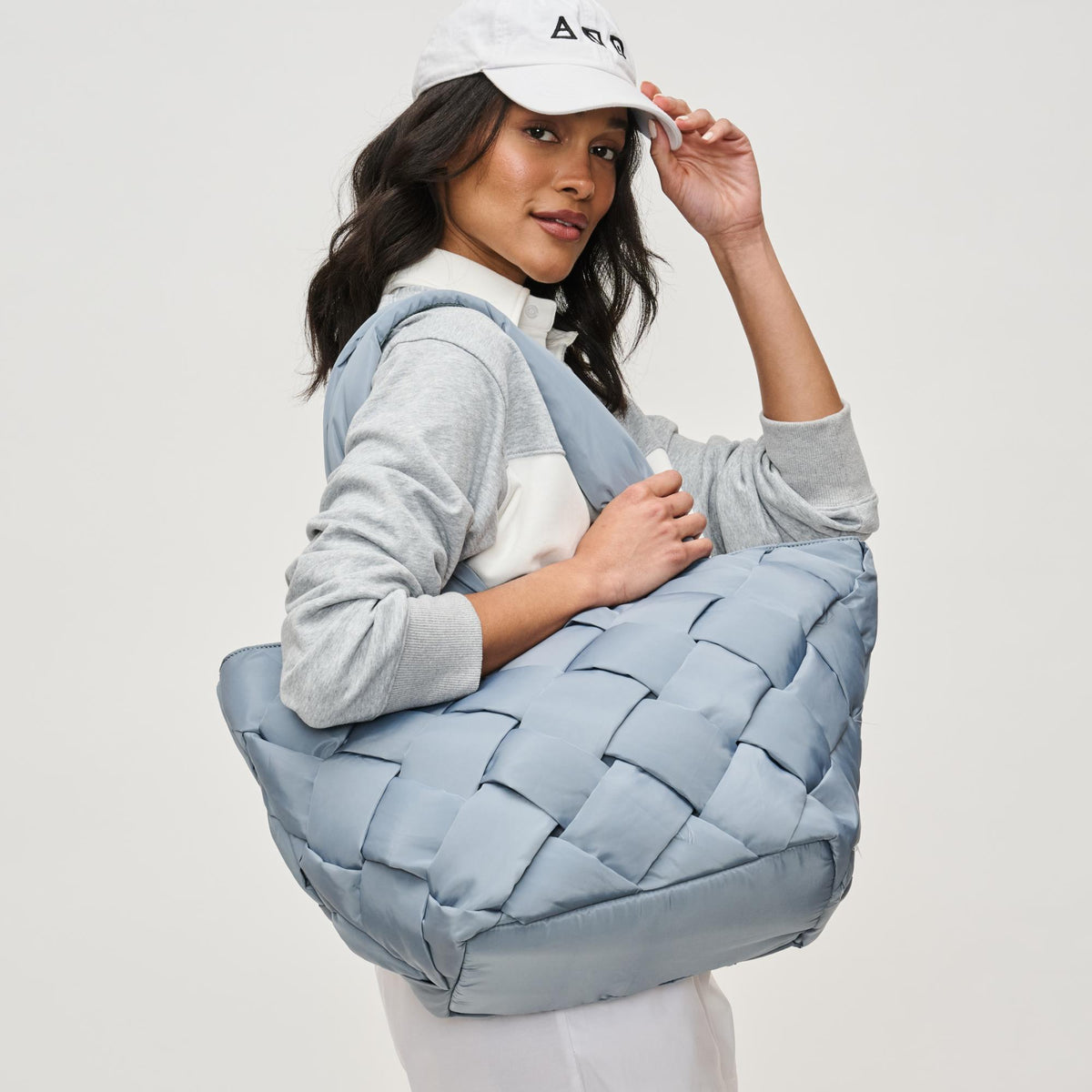 Woman wearing Slate Sky Sol and Selene Intuition East West Tote 841764111867 View 1 | Slate Sky