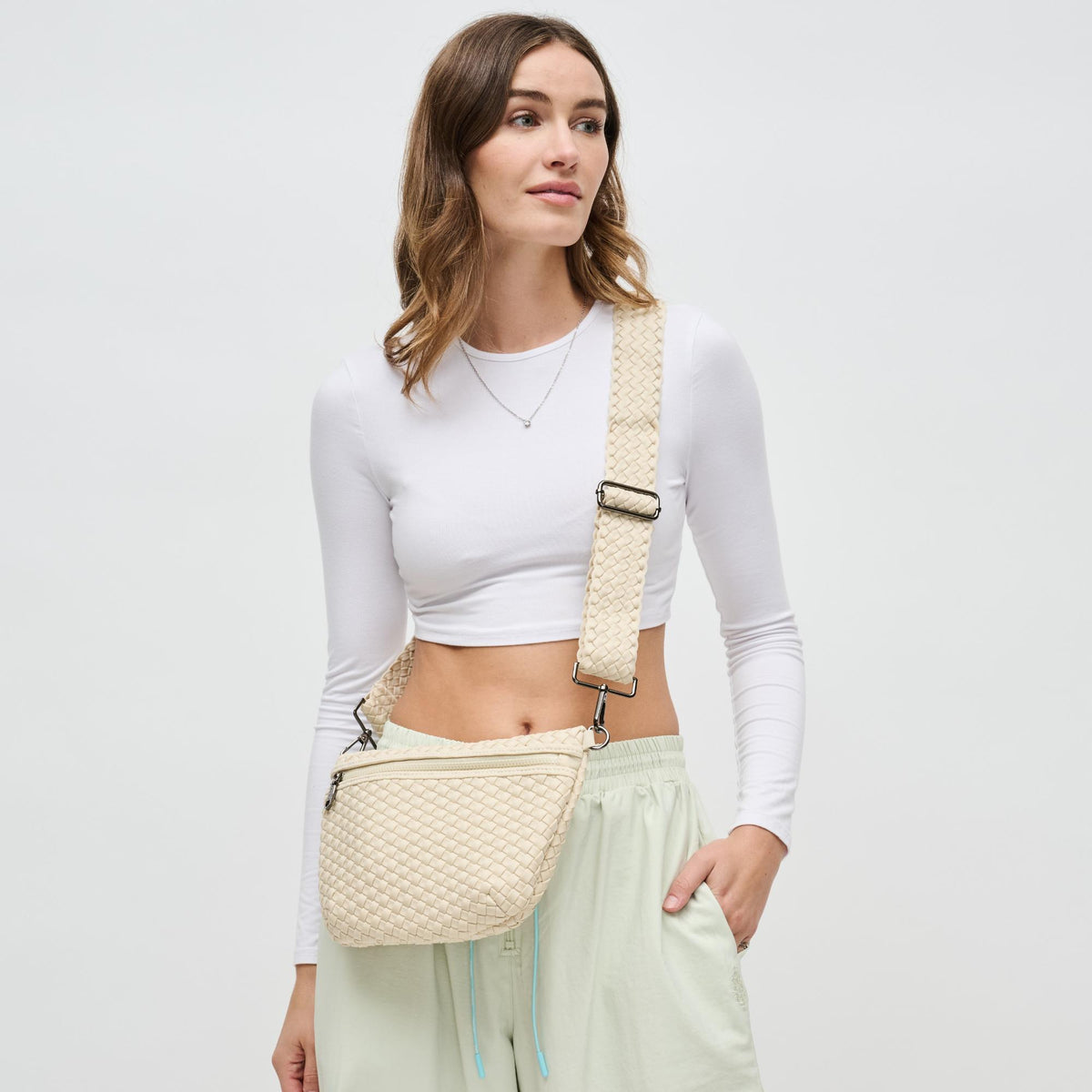 Woman wearing Cream Sol and Selene Ethereal - Woven Neoprene Crossbody 841764110846 View 1 | Cream