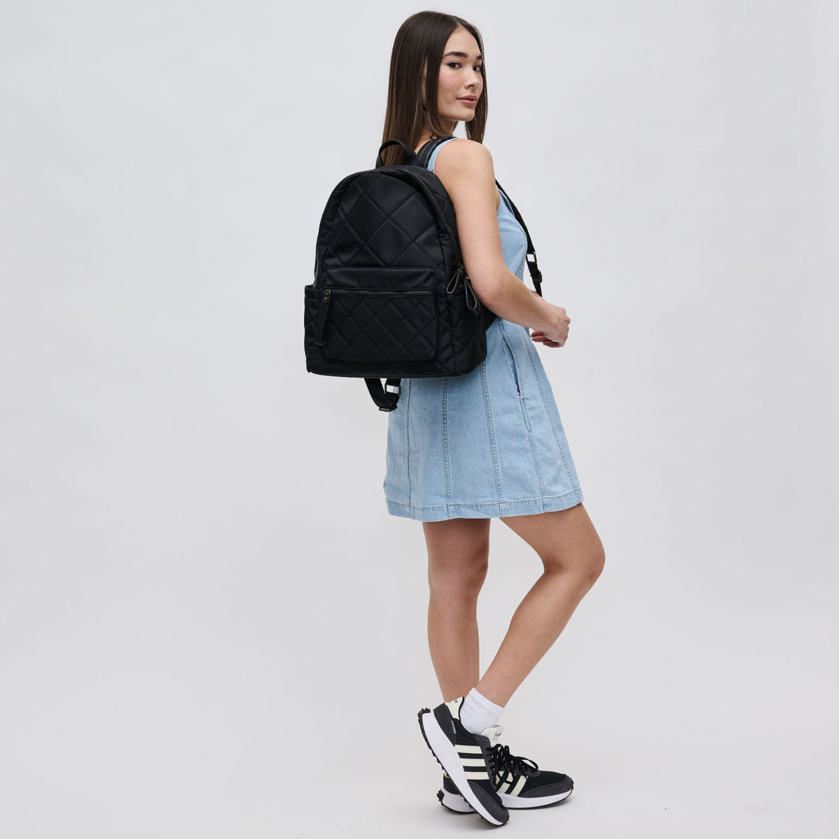 Woman wearing Black Sol and Selene Motivator - Medium Backpack 841764100076 View 3 | Black