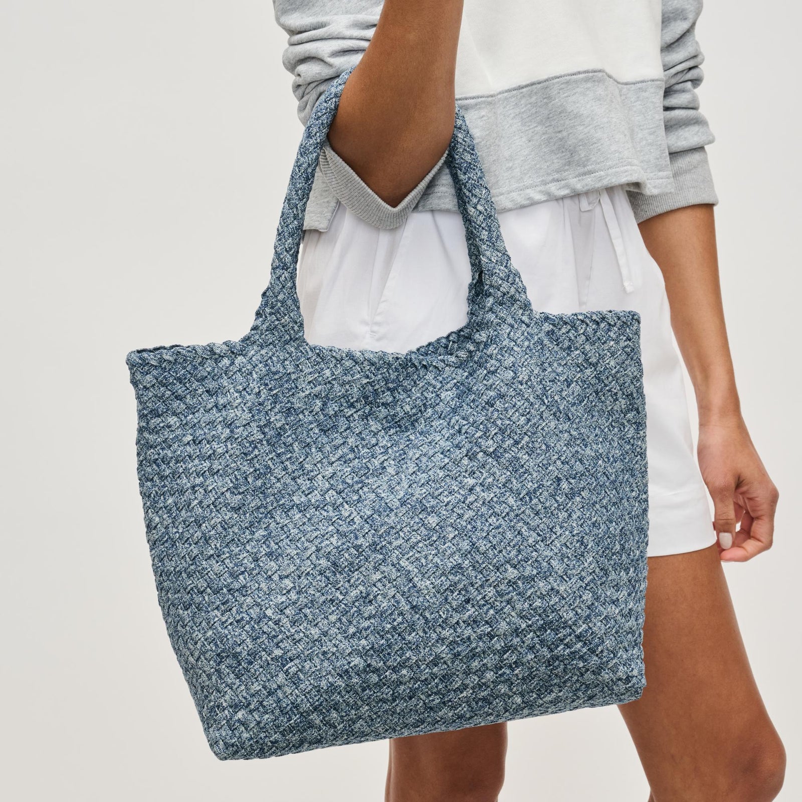 Woman wearing Denim Sol and Selene Sky's The Limit - Medium Denim Tote 841764111294 View 1 | Denim