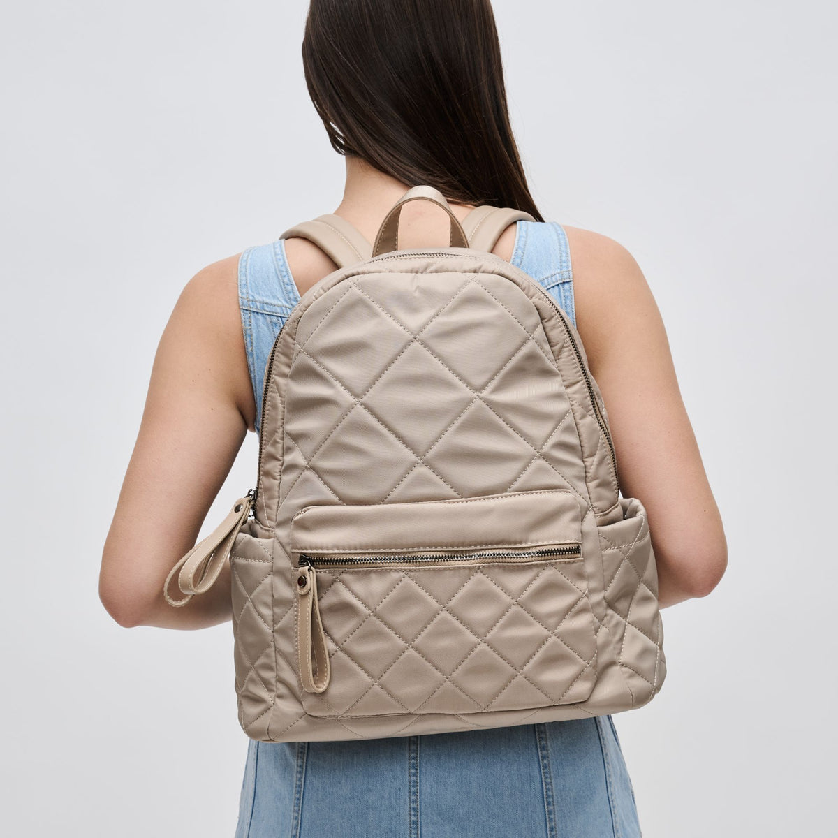 Woman wearing Nude Sol and Selene Motivator - Medium Backpack 841764107709 View 1 | Nude