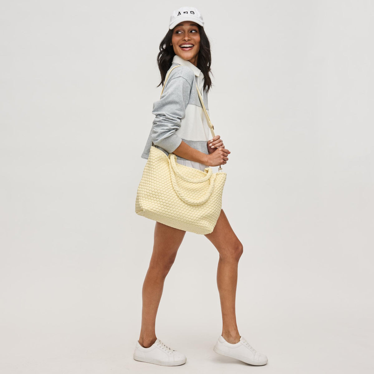 Woman wearing Butter Sol and Selene Sky's The Limit - Medium Laced Up Eco-Edition Tote 841764111607 View 4 | Butter