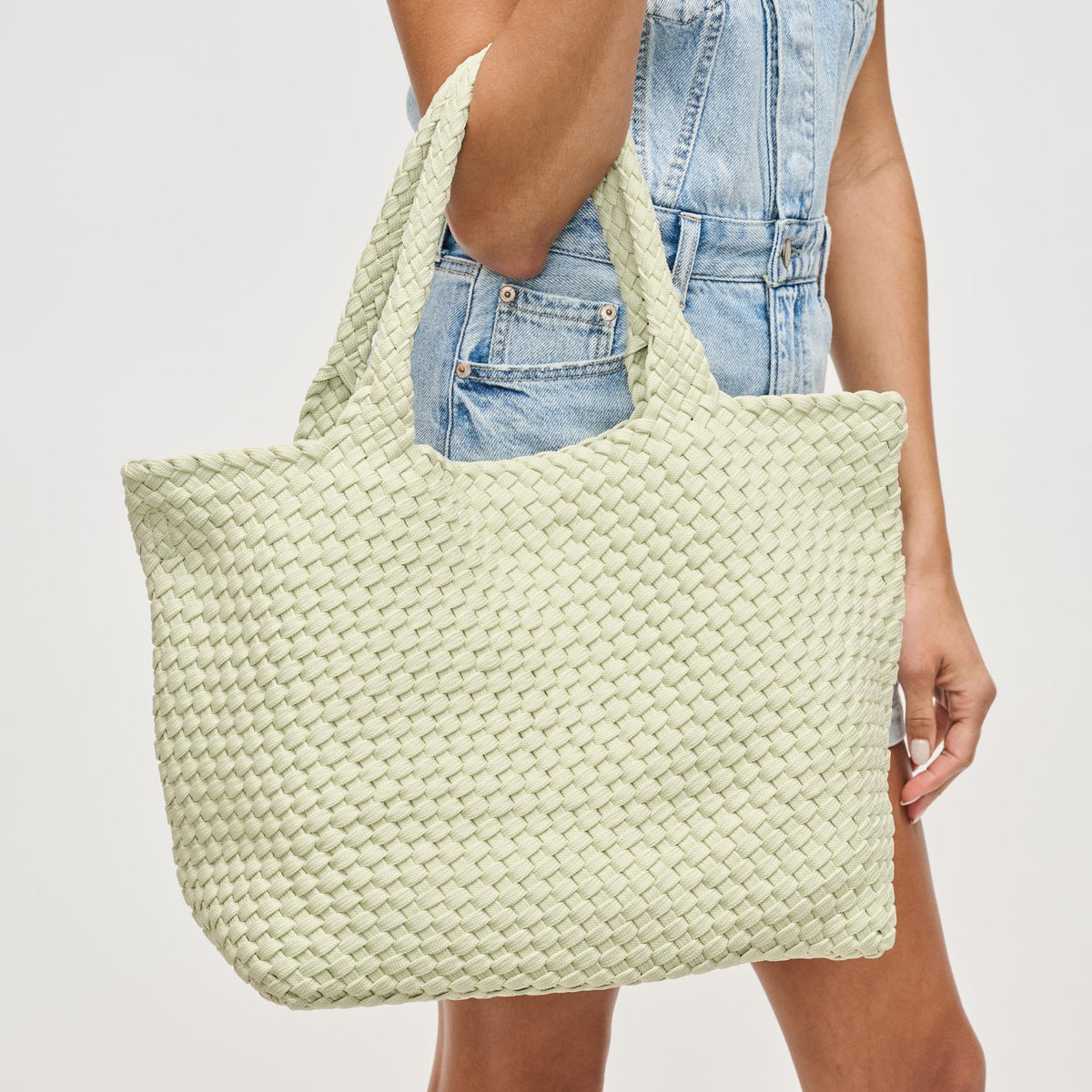 Woman wearing Pistachio Sol and Selene Sky's The Limit - Medium Laced Up Eco-Edition Tote 841764111638 View 2 | Pistachio