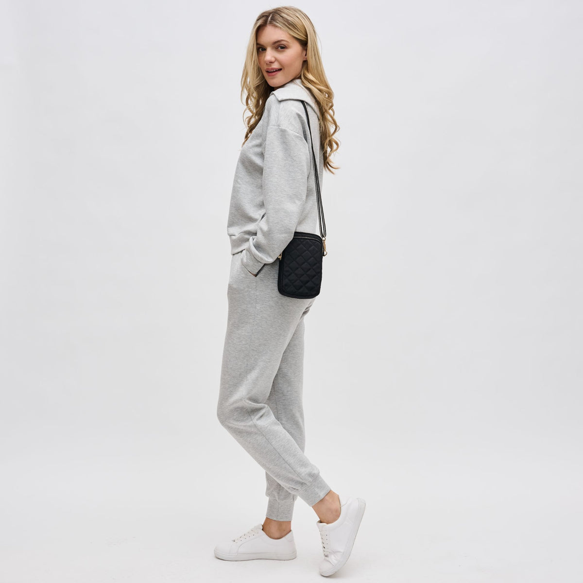 Woman wearing Black Sol and Selene Divide & Conquer - Quilted Crossbody 841764107440 View 2 | Black