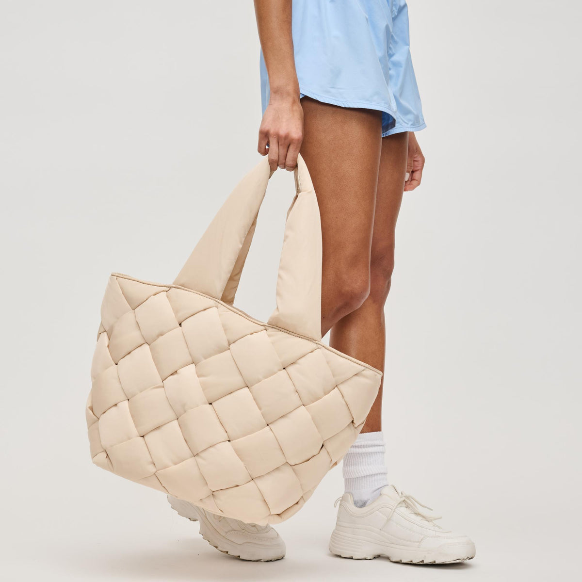 Woman wearing Cream Sol and Selene Intuition East West Tote 841764111843 View 3 | Cream