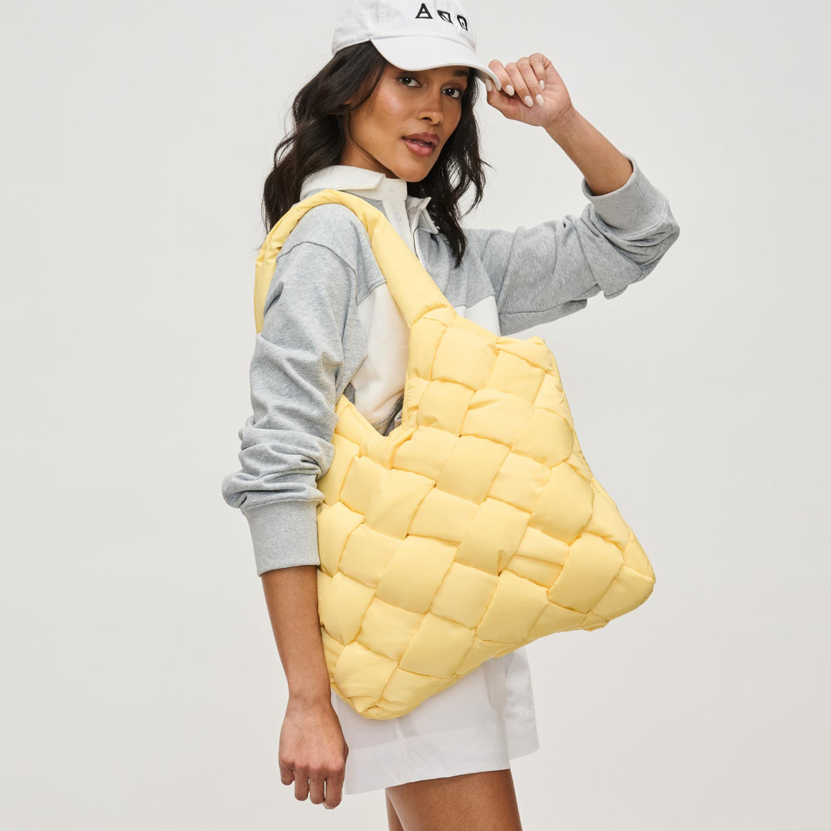 Woman wearing Butter Sol and Selene Illumine Tote 841764111904 View 2 | Butter