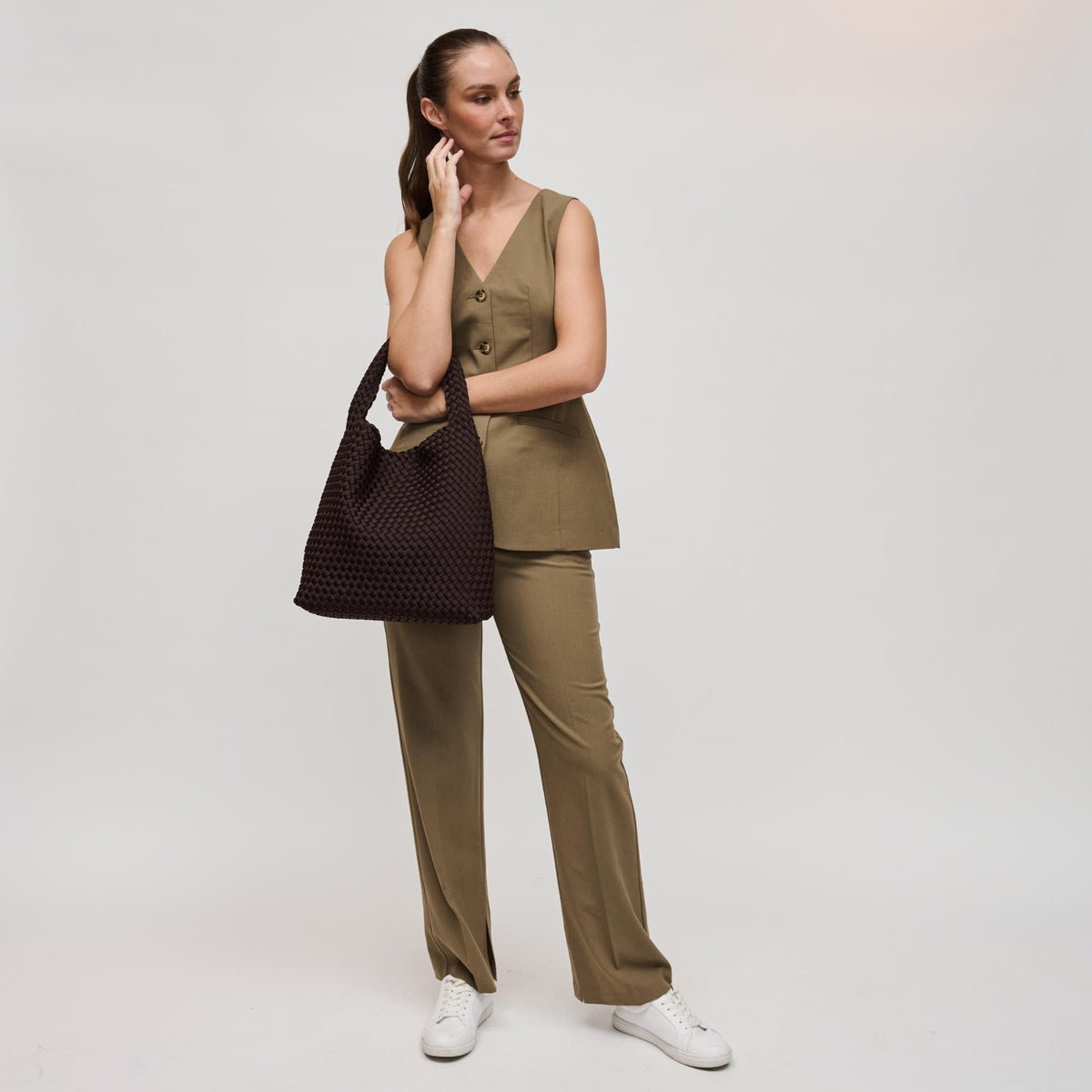 Woman wearing Chocolate Sol and Selene Celestial Woven Neoprene Hobo 841764112314 View 2 | Chocolate