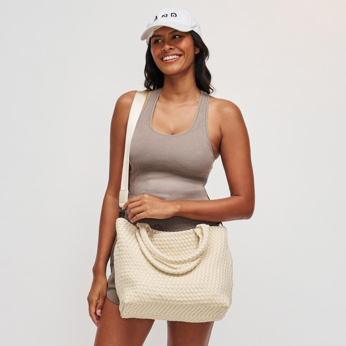 Woman wearing Cream Sol and Selene Sky's The Limit - Medium Tote 841764109246 View 2 | Cream