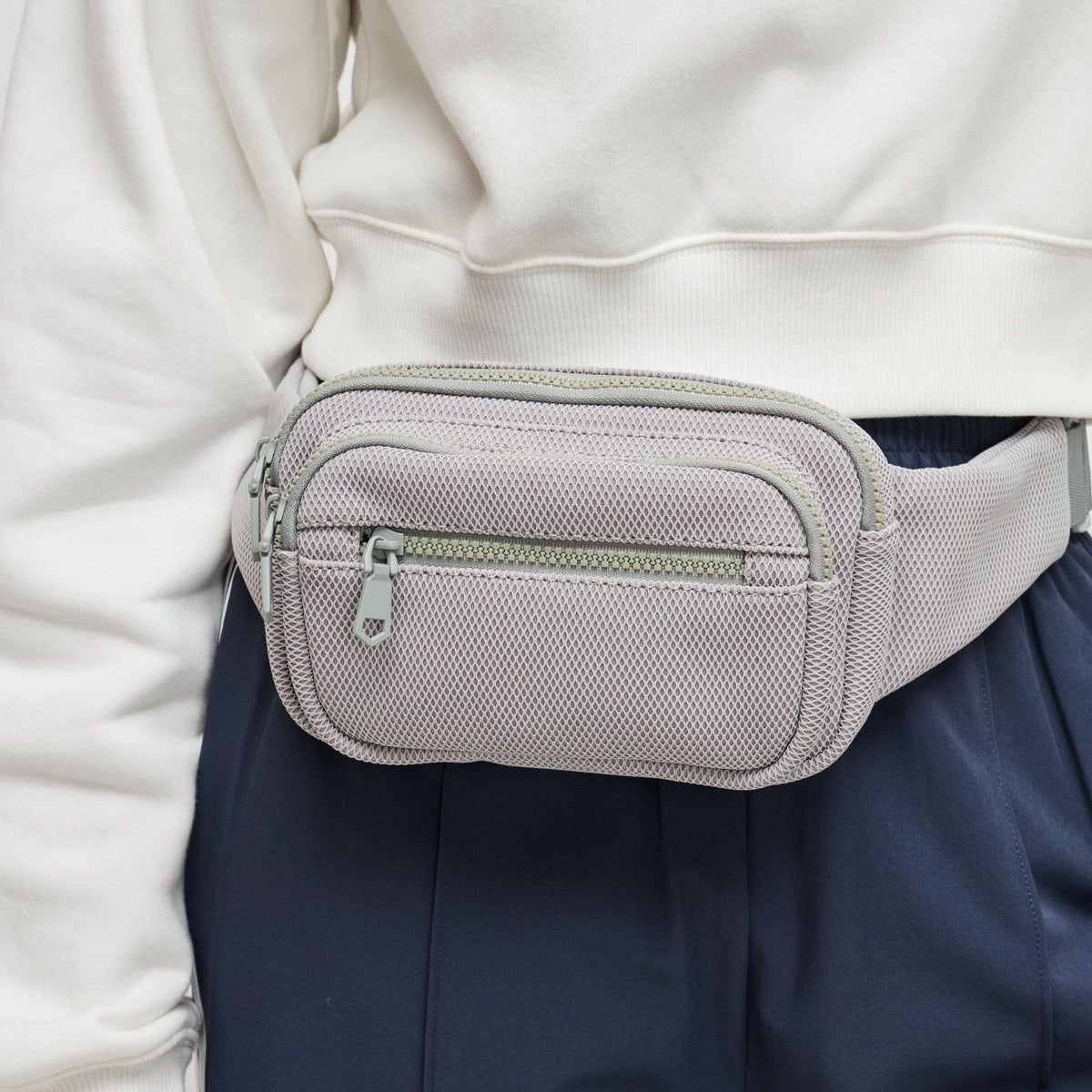 Woman wearing Grey Sol and Selene Hip Hugger - Neoprene Mesh Belt Bag 841764109871 View 3 | Grey