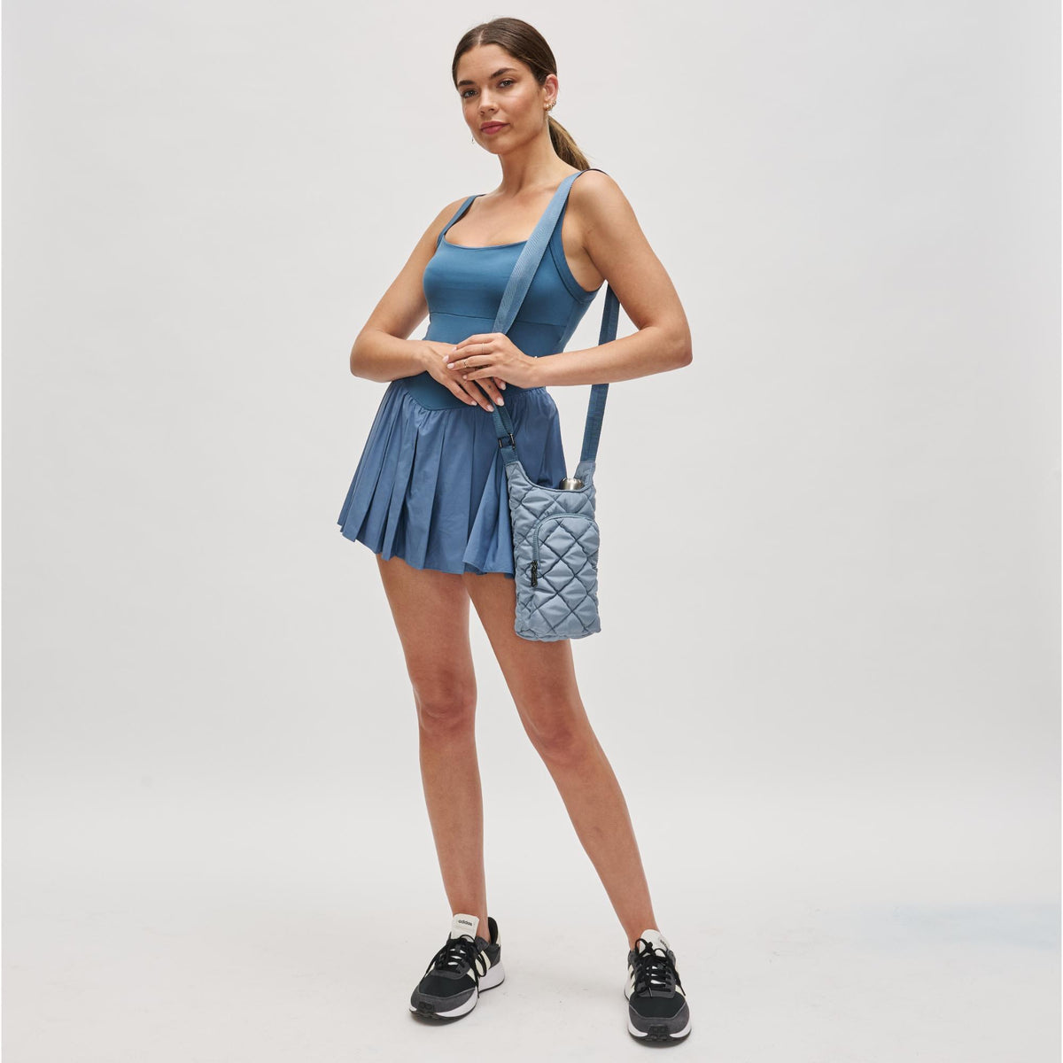 Woman wearing Slate Sky Sol and Selene Let It Flow - Puffer Crossbody 841764112093 View 3 | Slate Sky