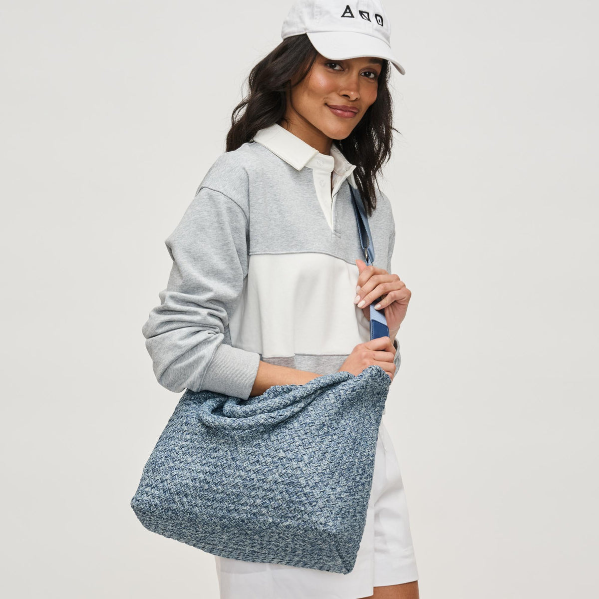 Woman wearing Denim Sol and Selene Sky's The Limit - Medium Denim Tote 841764111294 View 3 | Denim