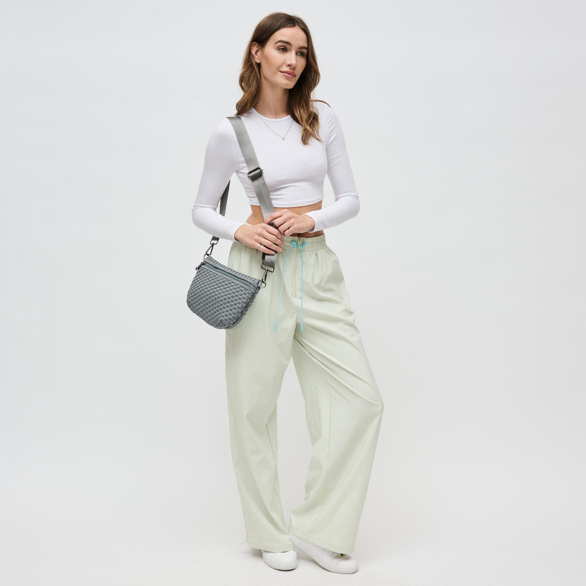 Woman wearing Grey Sol and Selene Ethereal - Woven Neoprene Crossbody 841764110877 View 2 | Grey