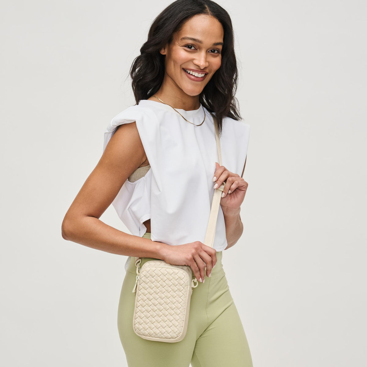 Woman wearing Cream Sol and Selene Divide & Conquer - Woven Neoprene Crossbody 841764109239 View 1 | Cream