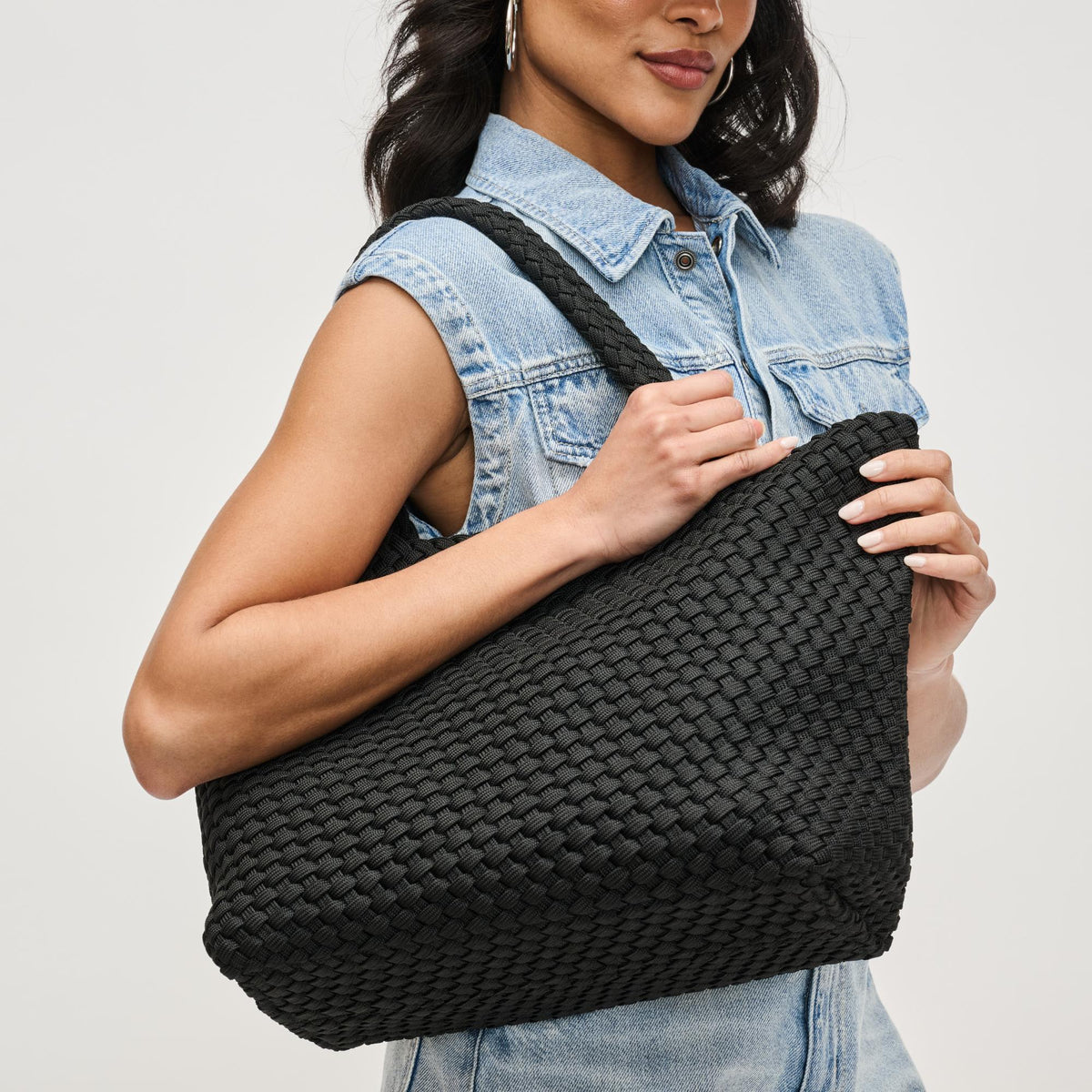 Woman wearing Black Sol and Selene Sky's The Limit - Medium Laced Up Eco-Edition Tote 841764111591 View 1 | Black