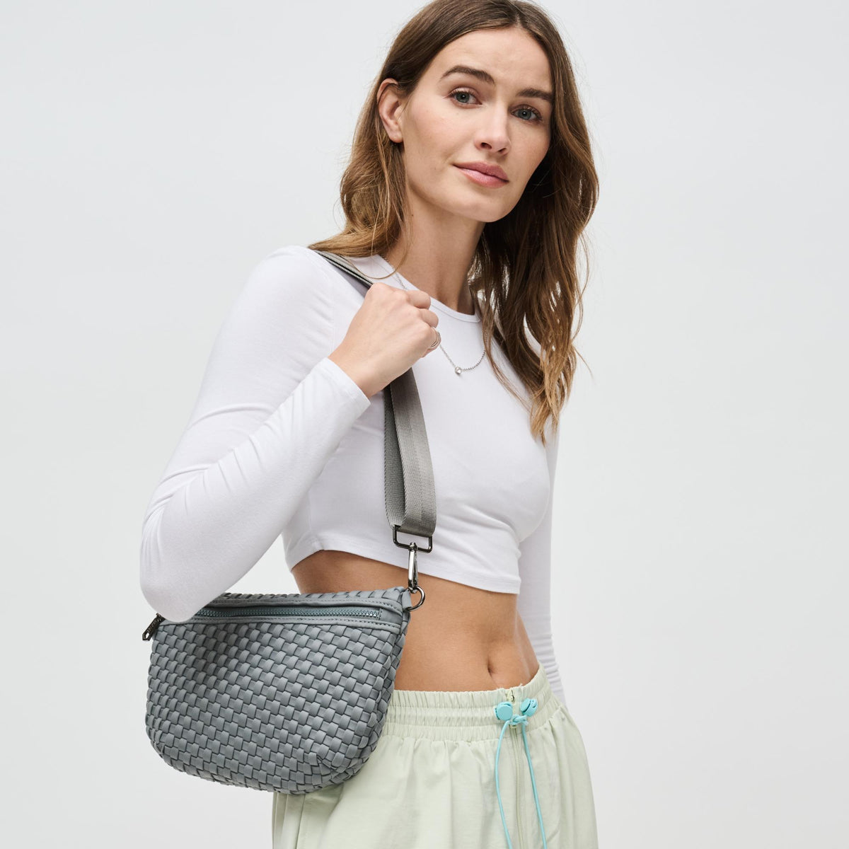 Woman wearing Grey Sol and Selene Ethereal - Woven Neoprene Crossbody 841764110877 View 1 | Grey