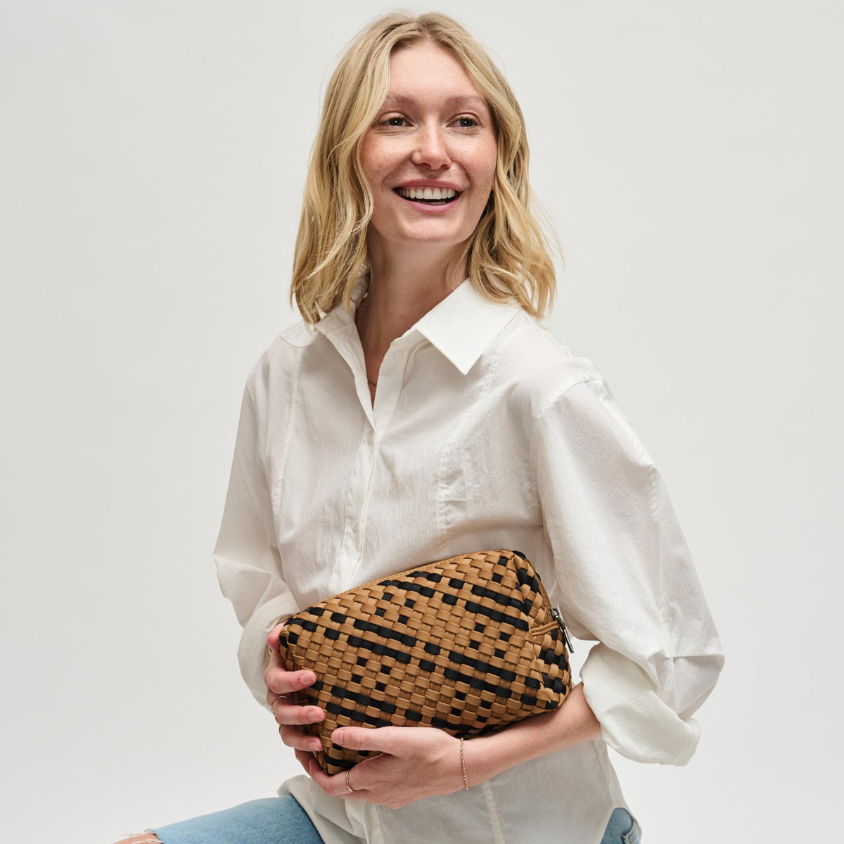 Woman wearing Sand Black Sol and Selene Altitude - Woven Neoprene Cosmetic & Travel Organizer Pouch 841764112482 View 2 | Sand Black