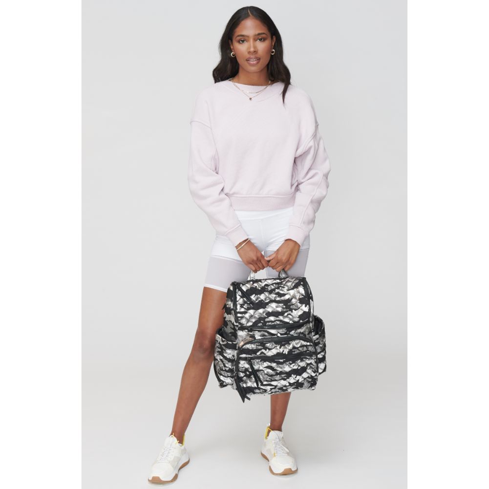 Woman wearing Silver Metallic Camo Sol and Selene Destination Backpack 841764104395 View 1 | Silver Metallic Camo