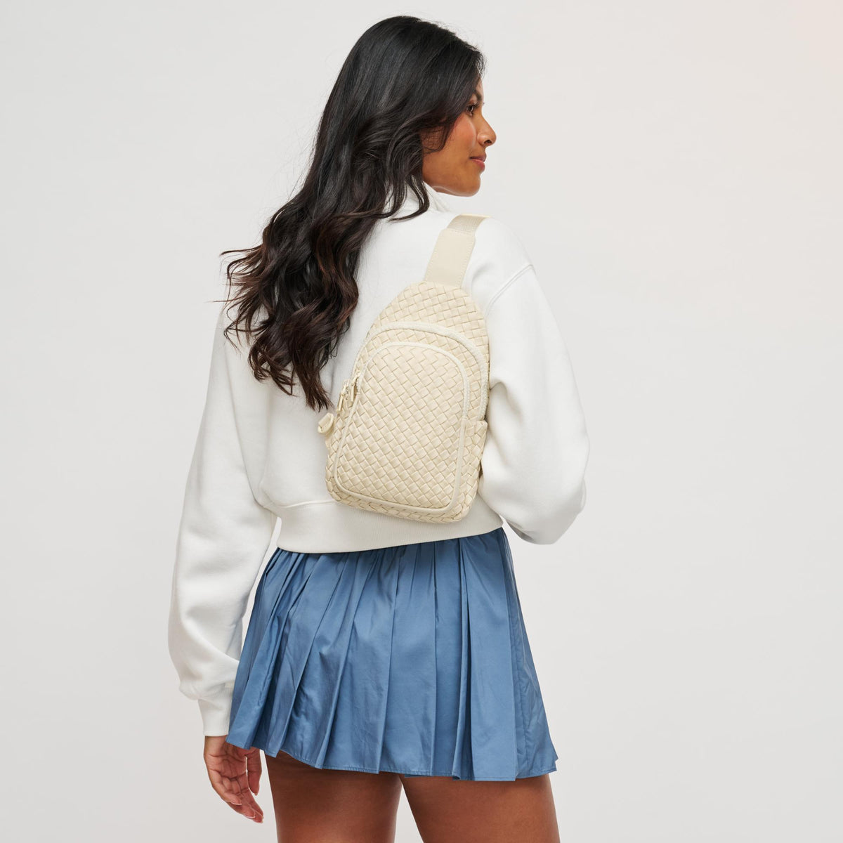 Woman wearing Cream Sol and Selene Beyond The Horizon - Woven Neoprene Sling Backpack 841764109277 View 2 | Cream