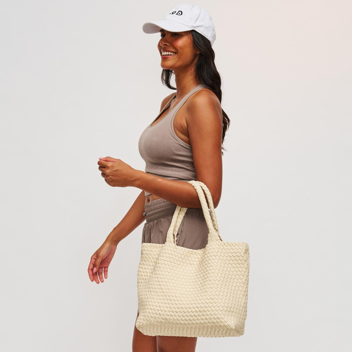 Woman wearing Cream Sol and Selene Sky's The Limit - Medium Tote 841764109246 View 3 | Cream