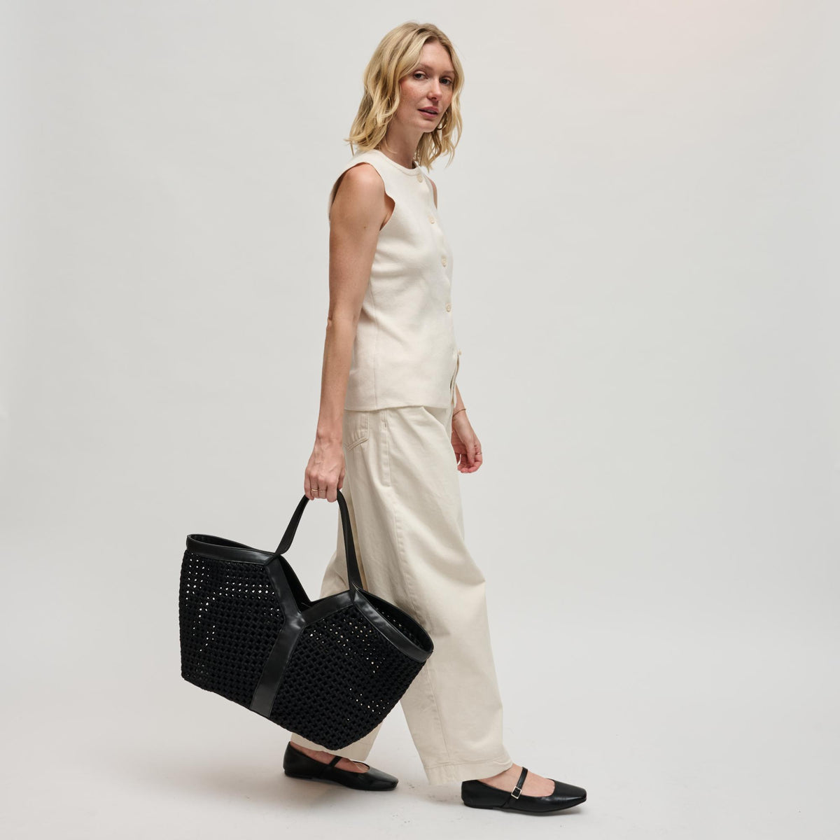 Woman wearing Black Sol and Selene Calypso Tote 841764112901 View 4 | Black