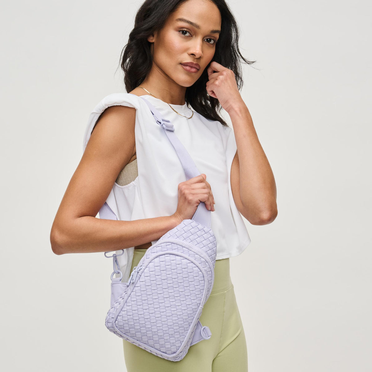 Woman wearing Lilac Sol and Selene Beyond The Horizon - Woven Neoprene Sling Backpack 841764111232 View 2 | Lilac