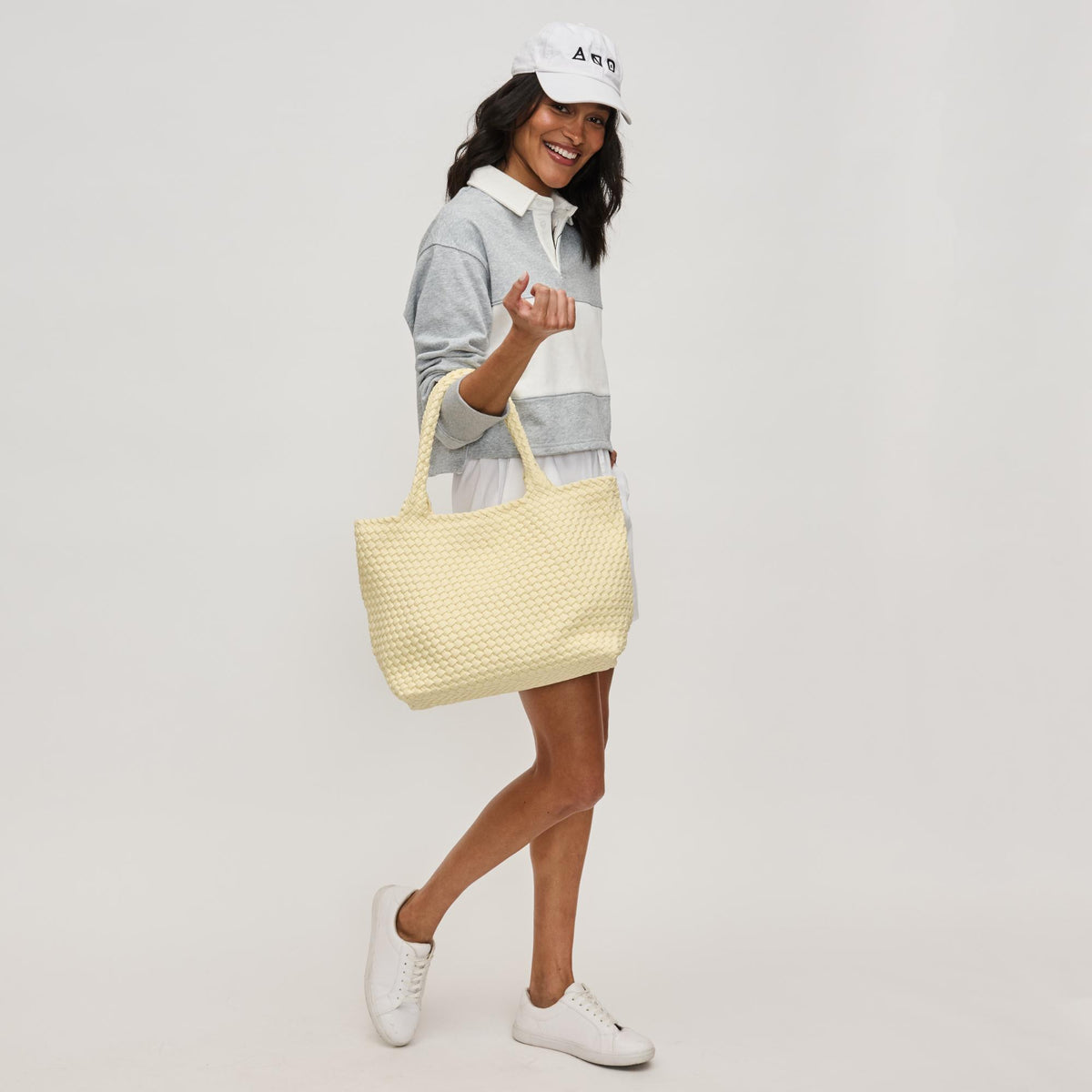 Woman wearing Butter Sol and Selene Sky's The Limit - Medium Laced Up Eco-Edition Tote 841764111607 View 2 | Butter