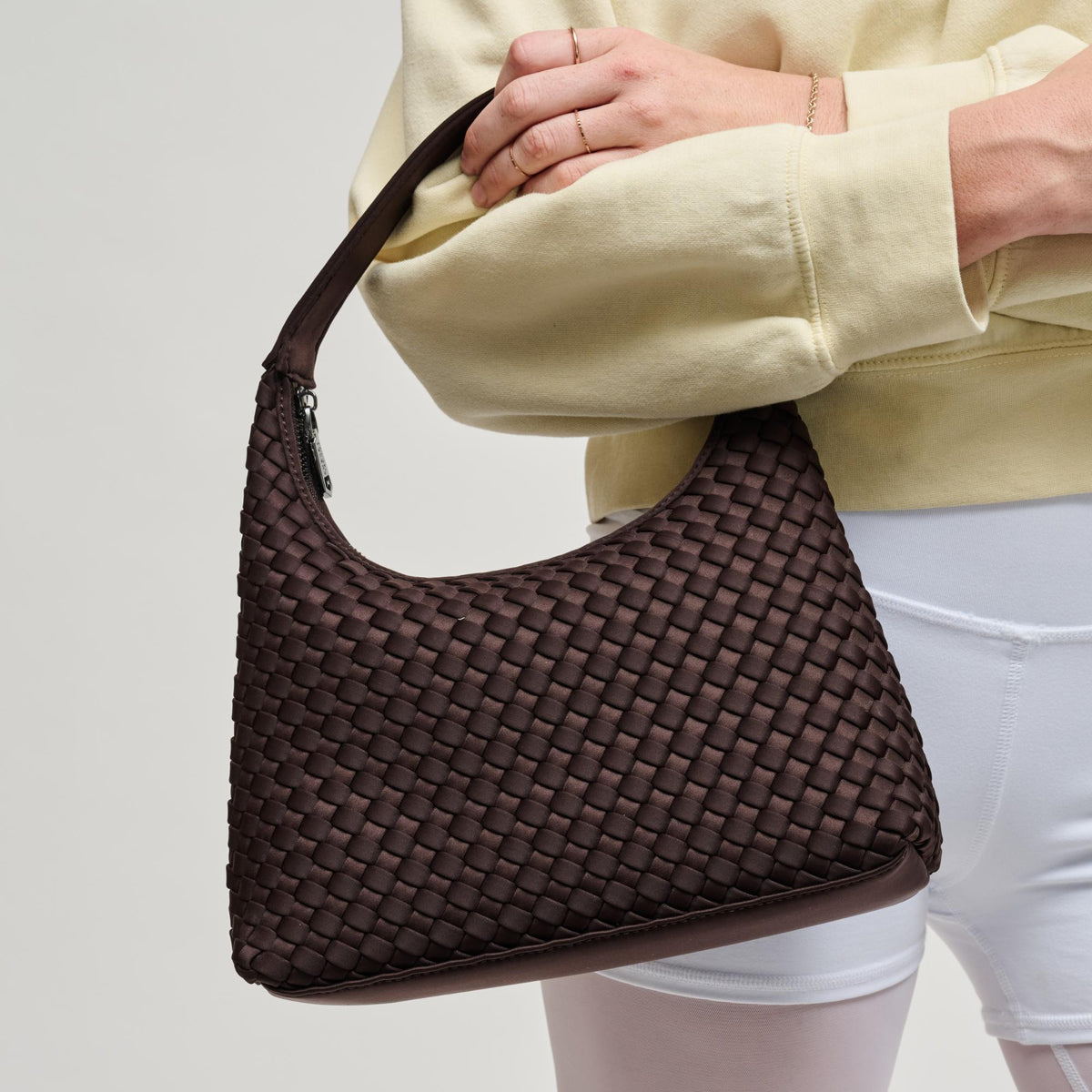 Woman wearing Chocolate Sol and Selene Harmonia - Woven Neoprene Shoulder Bag 841764112536 View 2 | Chocolate