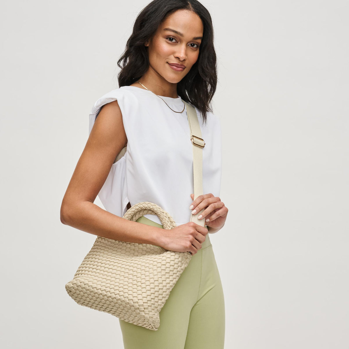 Woman wearing Beige Sol and Selene Sky's The Limit - Small Laced Up Eco-Edition Crossbody 841764111683 View 3 | Beige