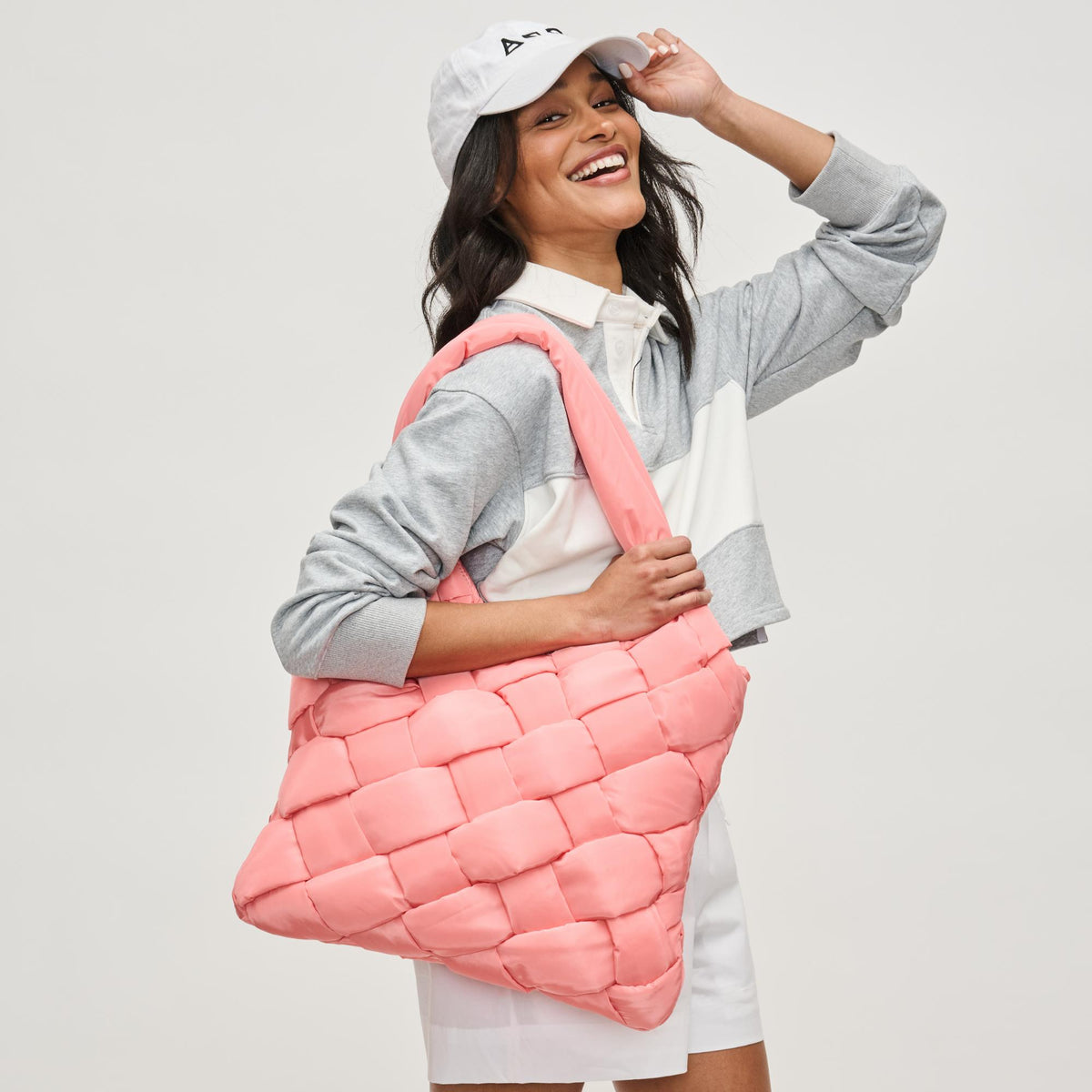 Woman wearing Salmon Sol and Selene Illumine Tote 841764111935 View 1 | Salmon
