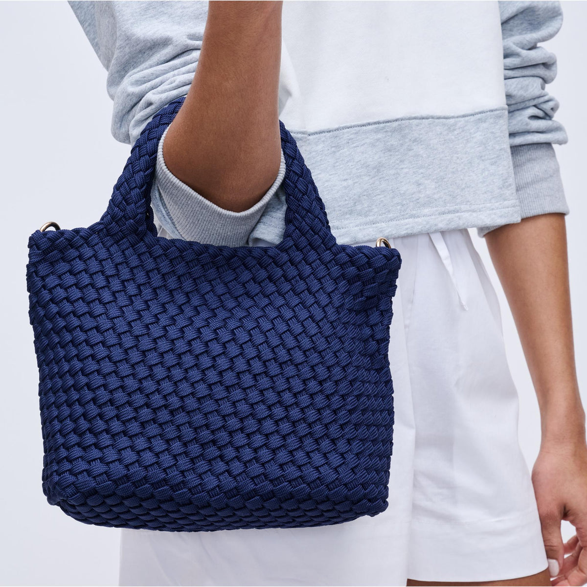 Woman wearing Navy Sol and Selene Sky's The Limit - Small Laced Up Eco-Edition Crossbody 841764111720 View 4 | Navy