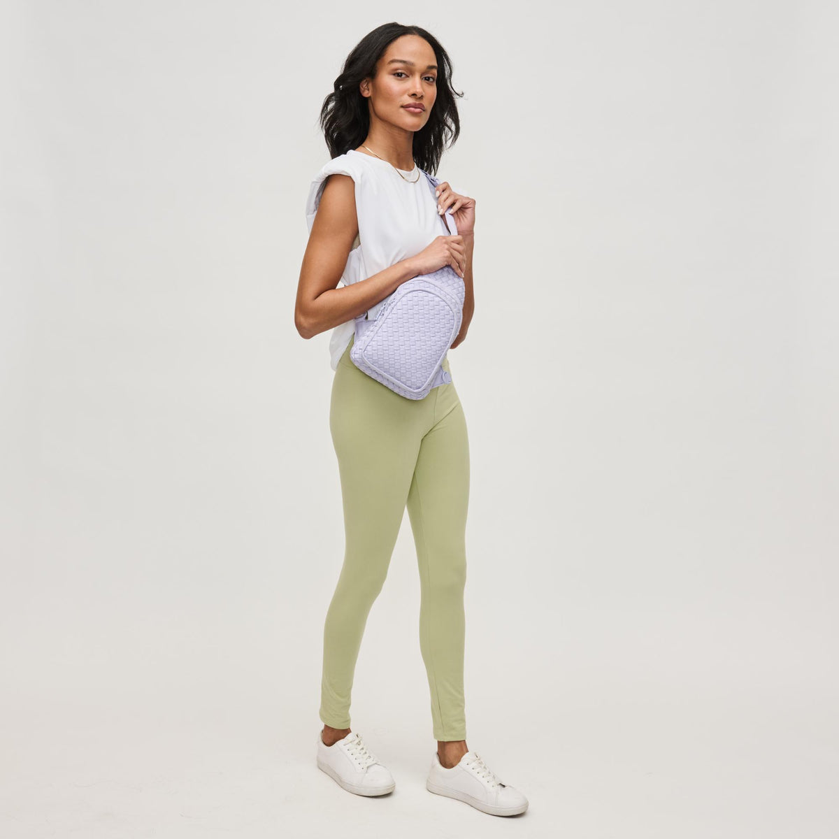 Woman wearing Lilac Sol and Selene Beyond The Horizon - Woven Neoprene Sling Backpack 841764111232 View 3 | Lilac