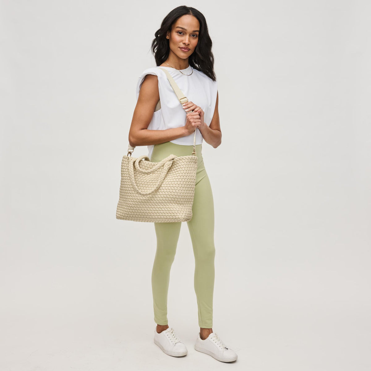 Woman wearing Beige Sol and Selene Sky's The Limit - Medium Laced Up Eco-Edition Tote 841764111584 View 4 | Beige