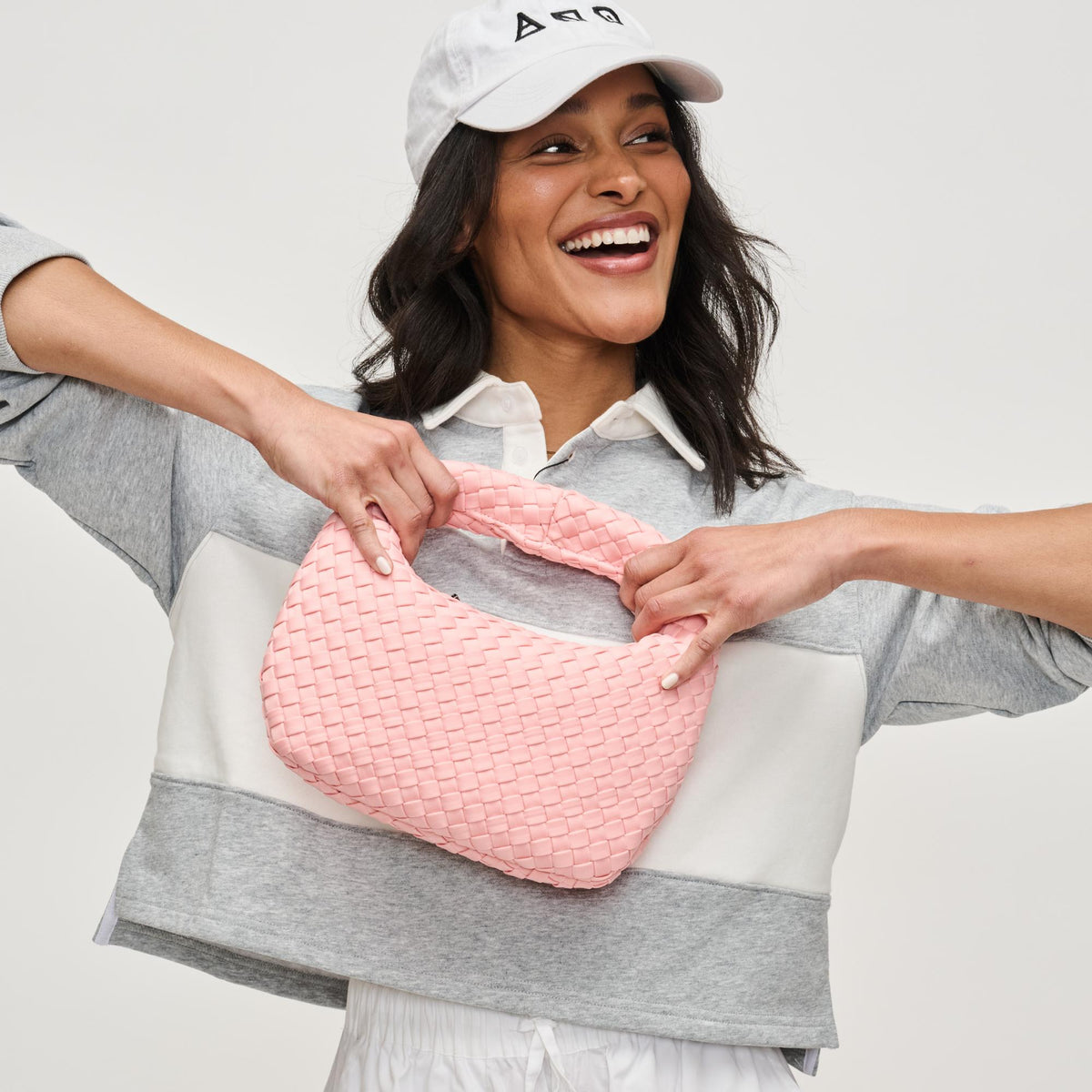 Woman wearing Blush Sol and Selene Dare to Dream - Small Woven Neoprene Clutch 841764111492 View 4 | Blush